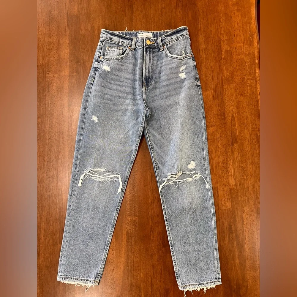 Bershka mom jeans high rise.  with rip in blue. Busted knee Size 4